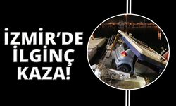 İzmir'de araç denizdeki teknenin üstüne düştü!