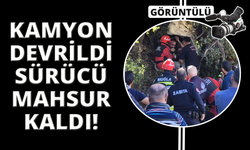 Kamyon şarampole devrildi, sürücü mahsur kaldı