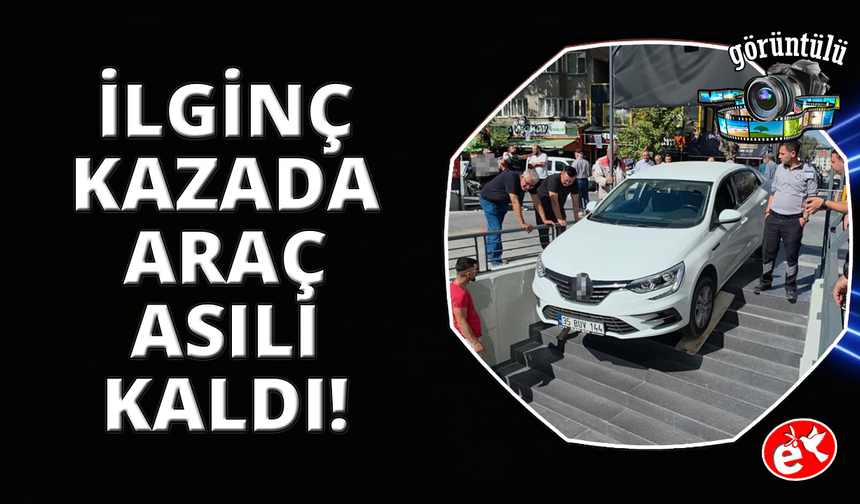 Kütahya'da ilginç kaza: Otomobil marketin merdivenlerinde asılı kaldı